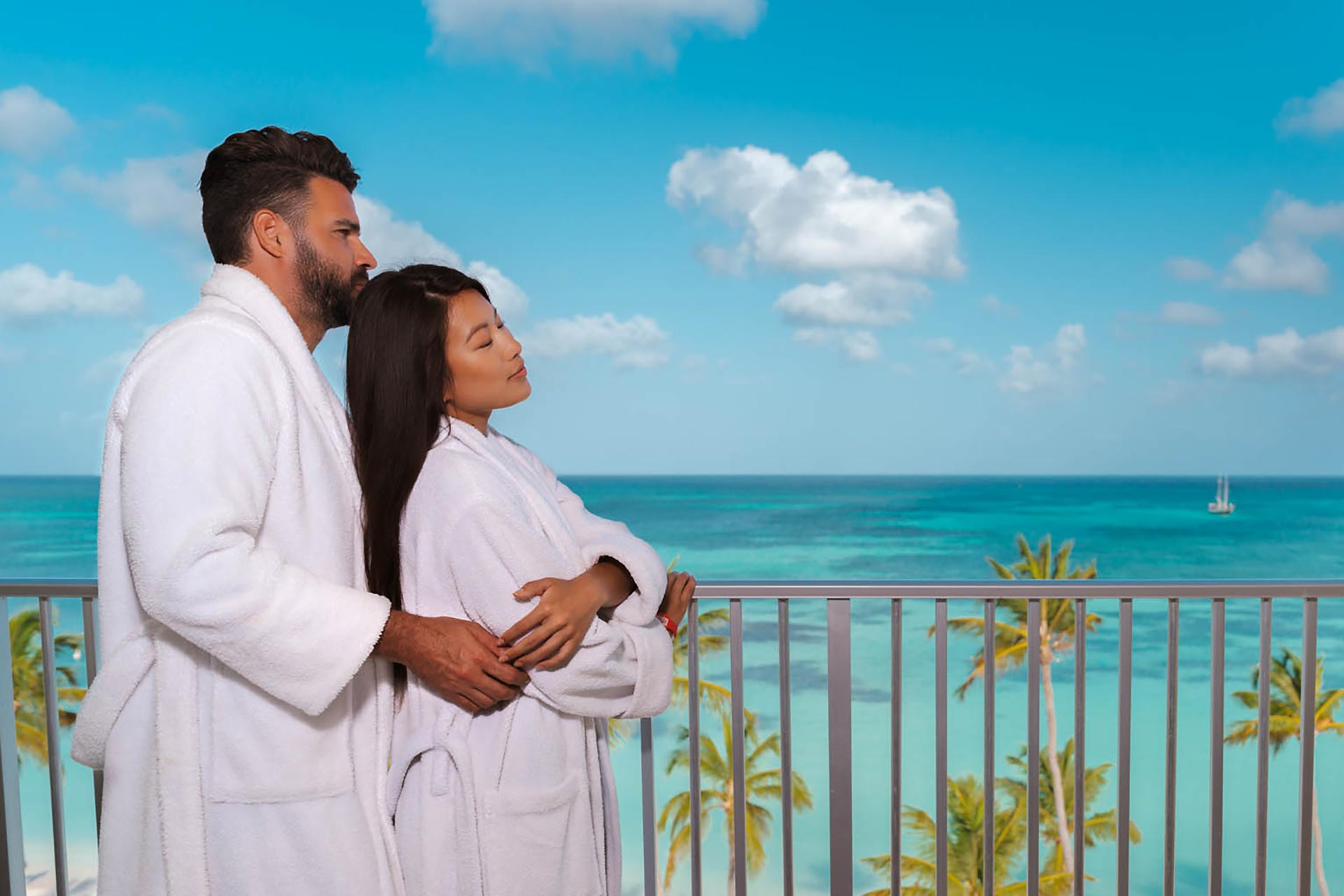 A couple hugging on a balcony