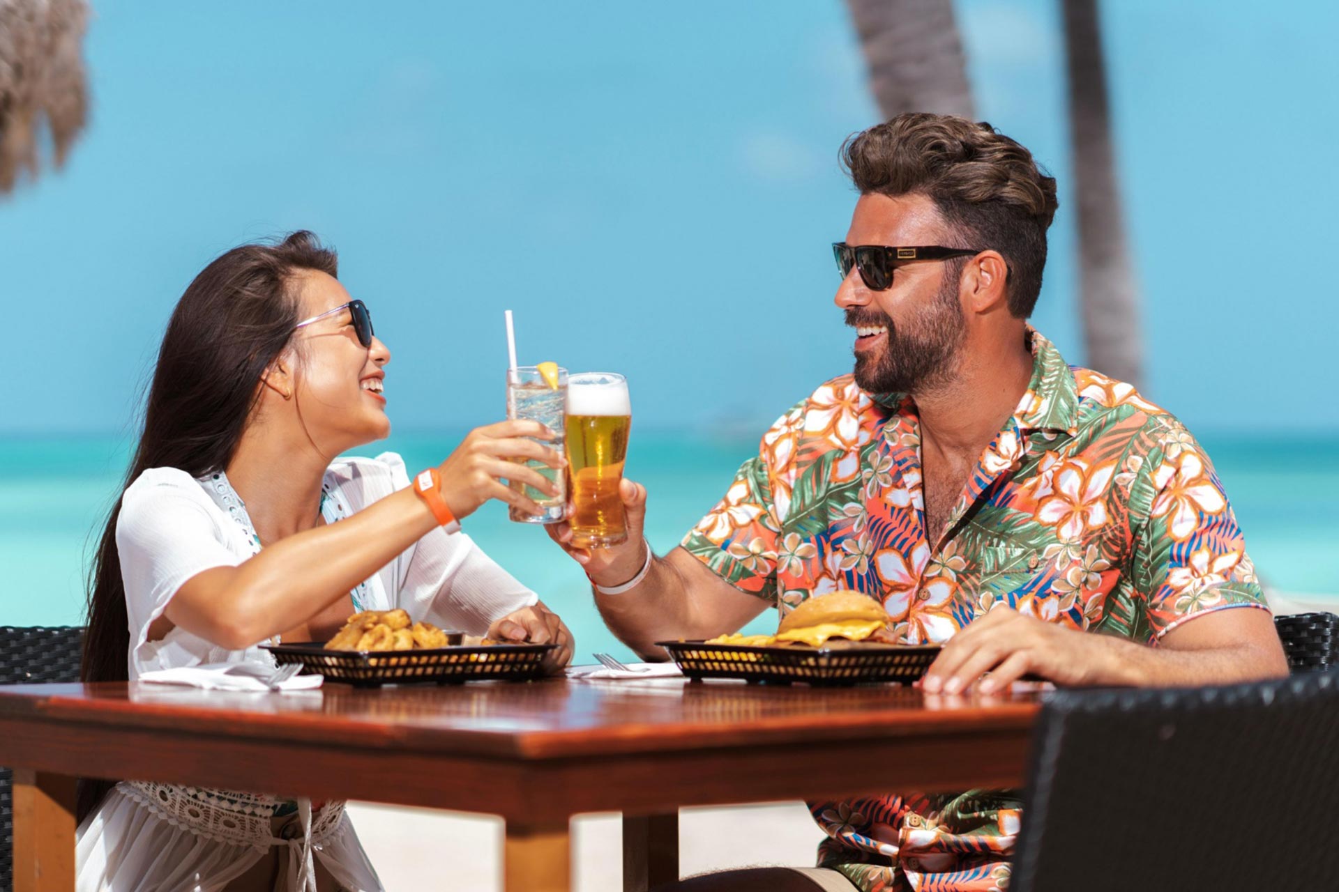 A couple cheering drinks